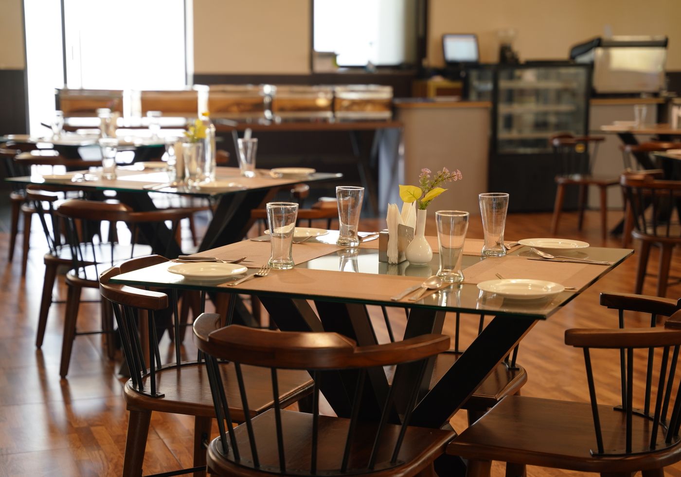The Olive & Ember demo homepage hero: a warm dining room photograph used beside the headline &ldquo;Seasonal cooking. Made to be shared.&rdquo;